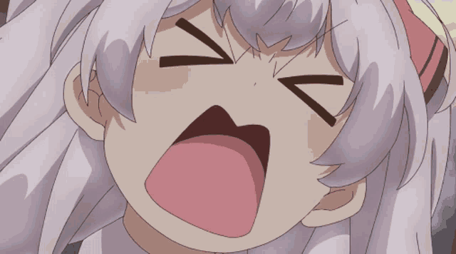 a close up of a girl making a funny face with her eyes closed
