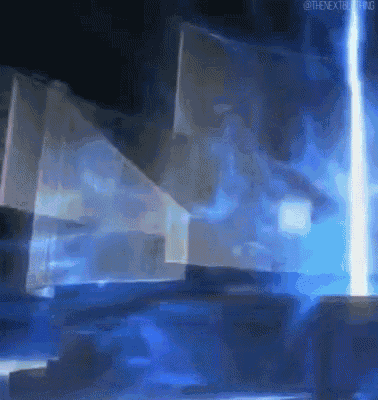 a blue light is coming out of a dark room
