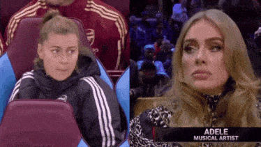 a woman sitting in a stadium next to a picture of adele musical artist