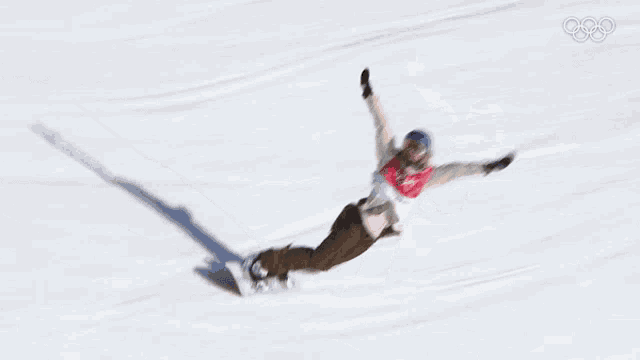 a snowboarder wearing a shirt that says ' olympus ' on it