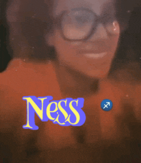 a woman wearing glasses with the word ness written on her face