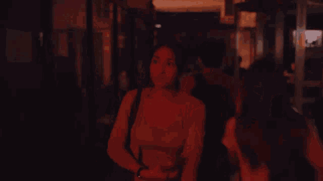 a blurred image of a crowd of people with the letters a and r visible