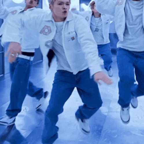 a man in a white jacket has a badge on his chest that says ' a '
