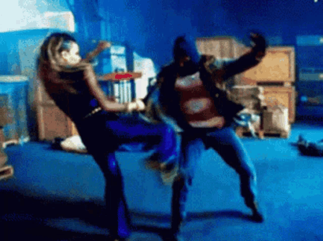 a blurry picture of two people dancing in a room