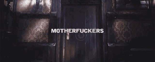 a dark room with the words motherfuckers on the bottom right
