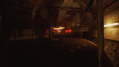 a dark tunnel with a yellow stripe on the floor that says ' emergency exit '