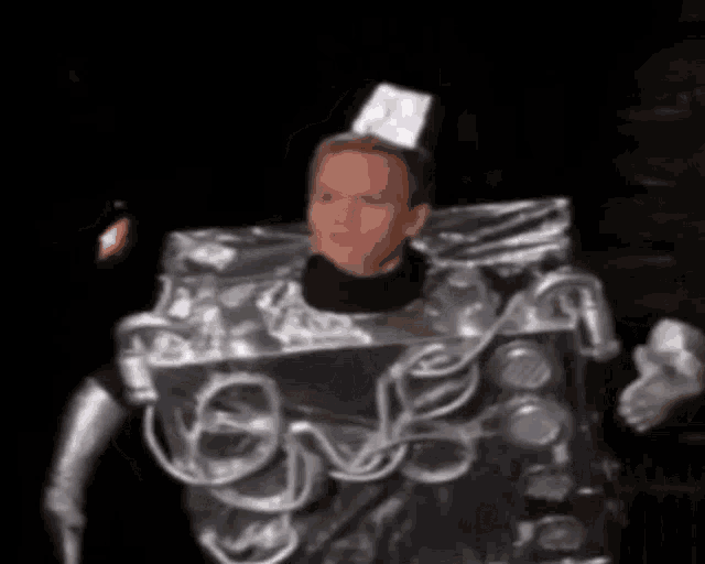 a man is dressed in a costume that looks like a can .