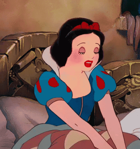 a cartoon of snow white is sitting on a bed with her eyes closed
