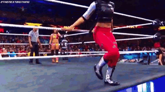 a woman in a wrestling ring with the next big thing written on the bottom right corner