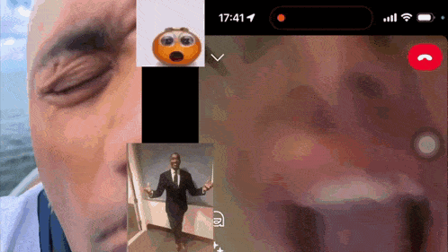 a phone screen shows a man in a suit with a surprised face