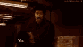 a close up of a man 's face with the words `` you done fucked up now '' written on it .