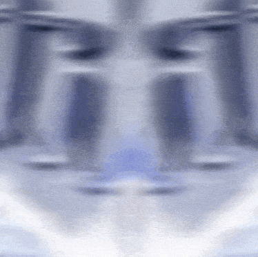a blurred image of a person 's face with a blue and white background