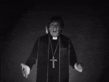 a black and white photo of a man wearing a mask