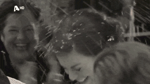 a black and white photo of a woman with a hd logo on the bottom right corner