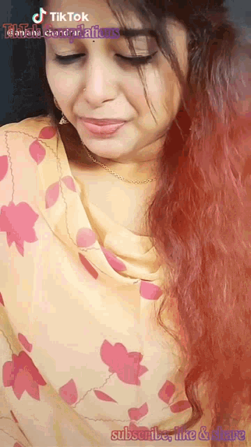 a woman 's face is displayed on a tiktok page