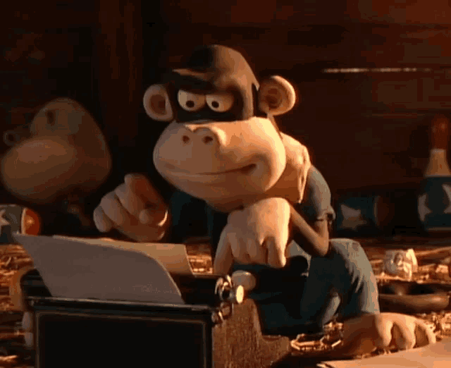 a cartoon monkey wearing a mask is sitting at a typewriter