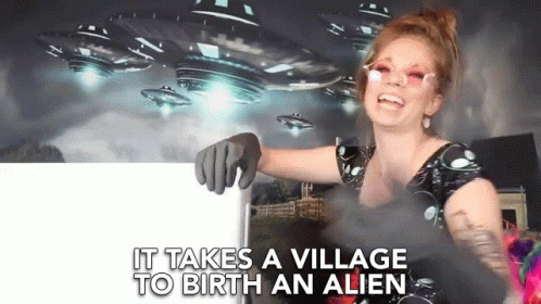 It Takes A Village To Birth An Alien Village GIF - It Takes A Village To Birth An Alien Village Birth An Alien GIFs