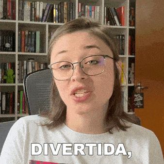 a woman wearing glasses and a white shirt with the word divertida on it