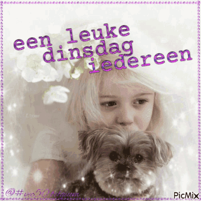 a picture of a little girl holding a small dog with the caption " een leuke dinsdag "