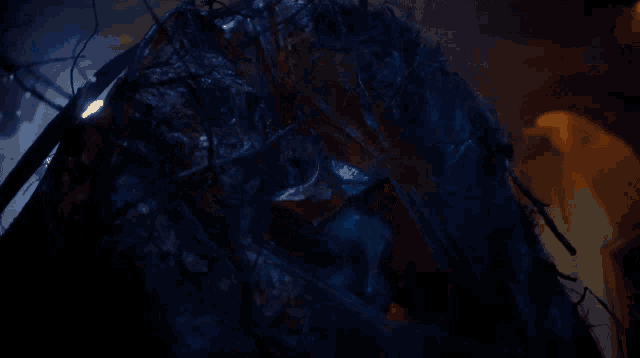 a dark room with a blue light coming out of the ceiling
