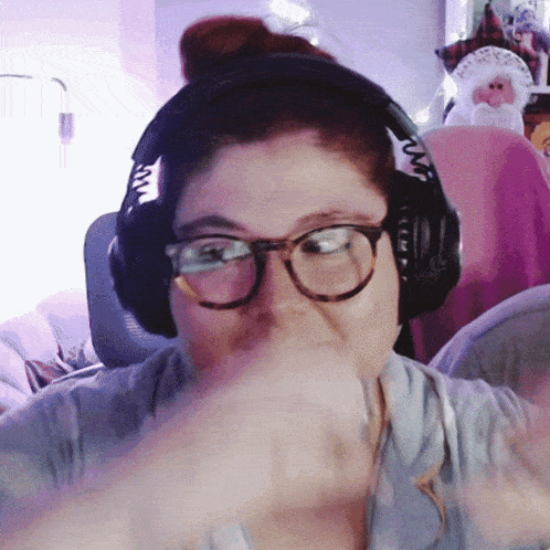a woman wearing glasses and headphones with the letter w on the side