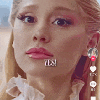 a close up of a woman 's face with the words yes written on her face
