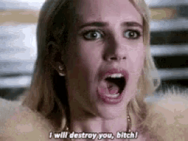 a close up of a woman 's face with her mouth open and the words `` i will destroy you , bitch ! ''