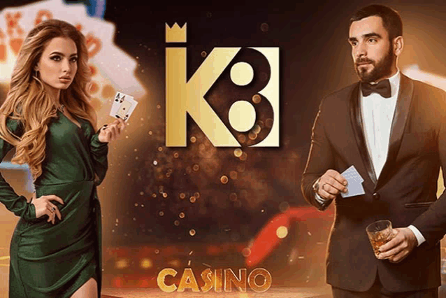 a man in a tuxedo holding a glass of whiskey and a woman in a green dress holding playing cards