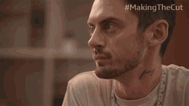 a man with a tattoo on his neck has the hashtag #makingthecut
