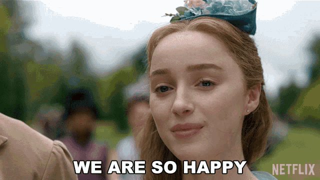 a woman says we are so happy while wearing a blue hat