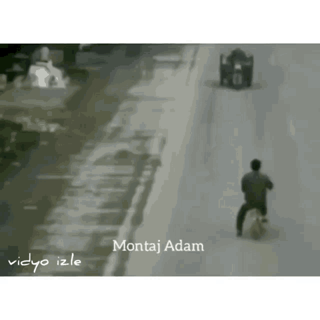 a man is riding a motorcycle down a street with the words montaj adam written on the bottom