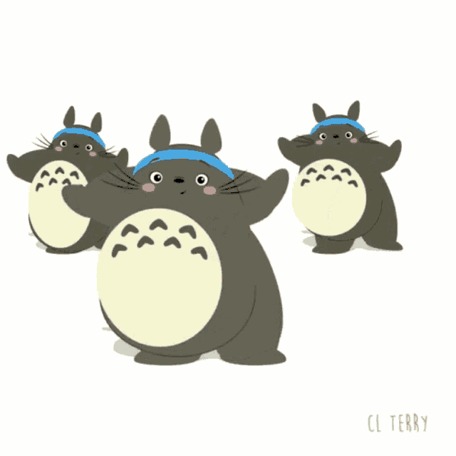 three totoro bears wearing blue headbands are dancing together