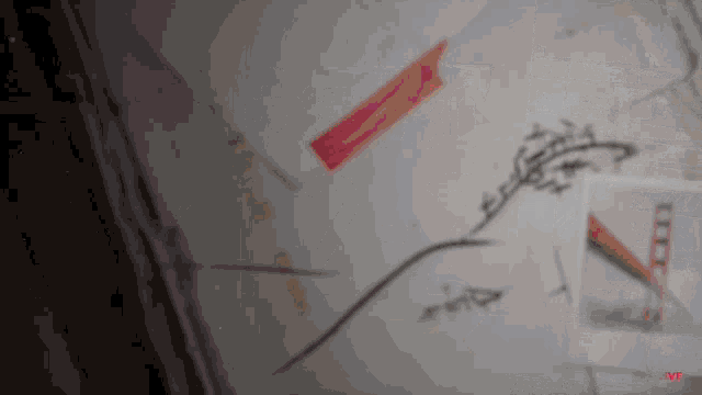 a blurred image of a wall with a red sticker that says ' vip '