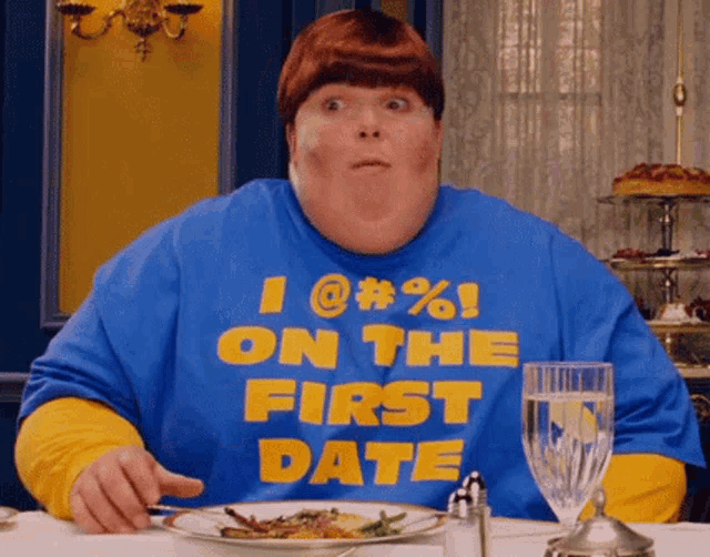 a man wearing a blue shirt that says " i @ # % on the first date "