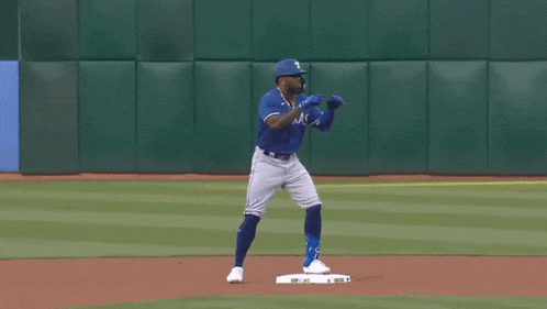 a texas baseball player stands on the base