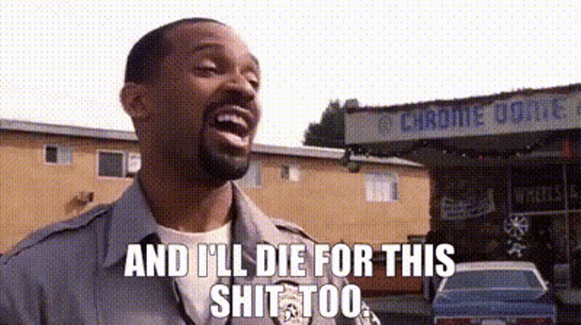 a man with a beard is standing in front of a building and says `` and i 'll die for this shit too ''