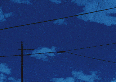 a row of power lines are lit up at night