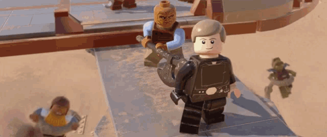 a lego figure holding a sword is standing next to another figure