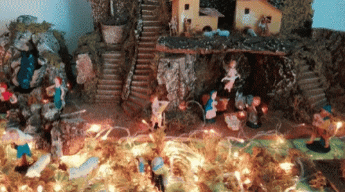 a nativity scene with a staircase and a house