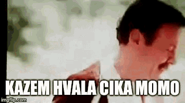 a man with a mustache is standing in front of a sign that says `` kazem hvala cica momo '' .