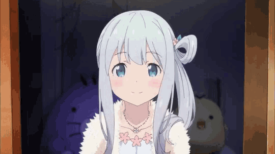 a girl with long white hair and blue eyes is standing in a dark room .