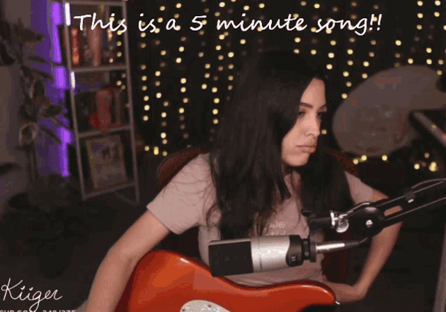 a woman singing into a microphone with the words " this is a 5 minute song " below her