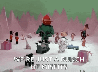 a bunch of misfits are standing in the snow .