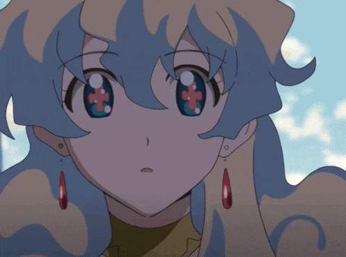 a close up of a girl 's face with blue eyes