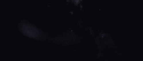 a cartoon character is flying through the air in a purple space surrounded by stars .