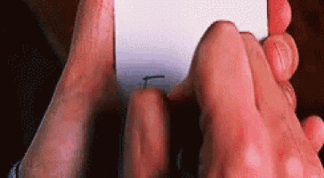 a close up of a person holding a piece of paper