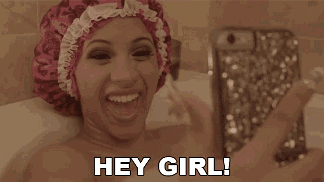 a woman in a bathtub with a shower cap on taking a picture of herself with the caption " hey girl "