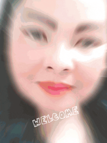 a blurry picture of a woman 's face with the word welcome written on it
