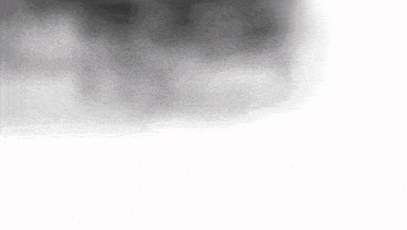 a black and white photo of a hot air balloon in the sky