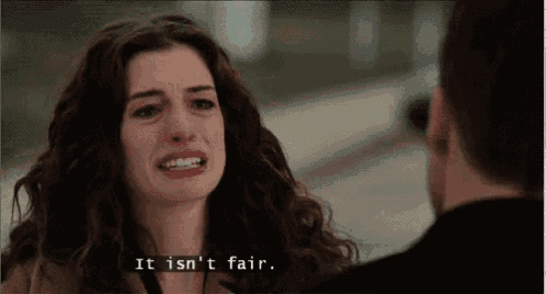 a woman is crying while talking to a man and says `` it is n't fair '' .